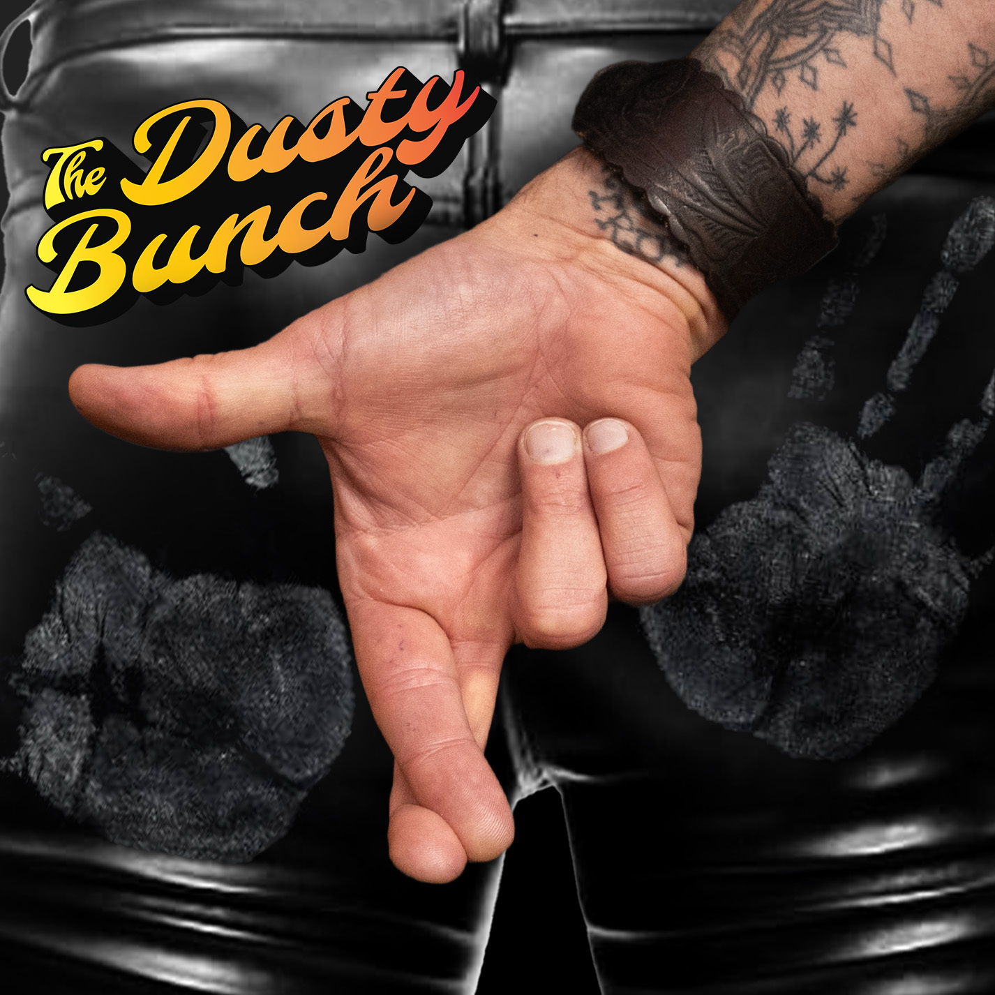 The Dusty Bunch cover art: hand throwing a rock sign against black leather